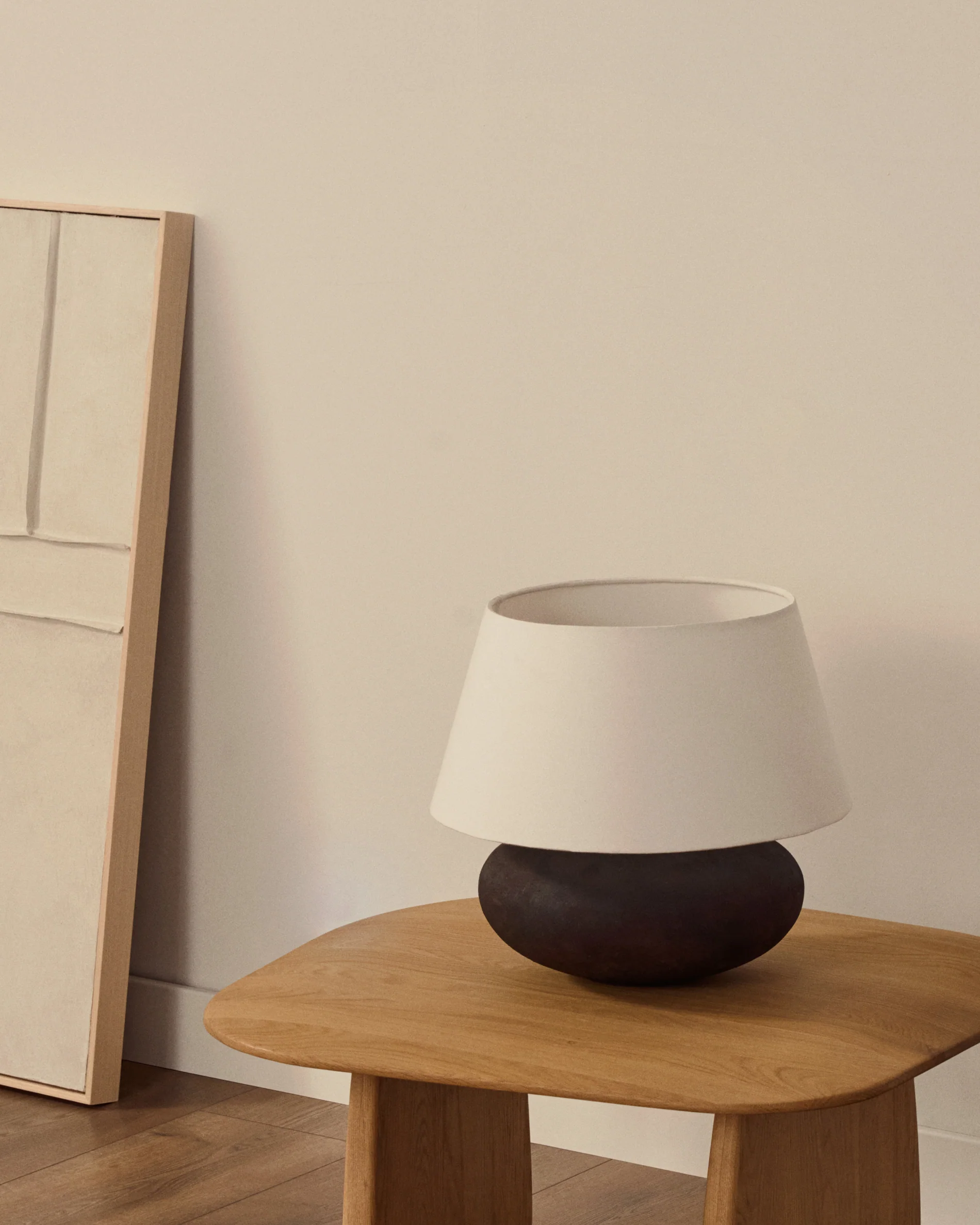 Nessi metal table lamp in a black terracotta effect finish