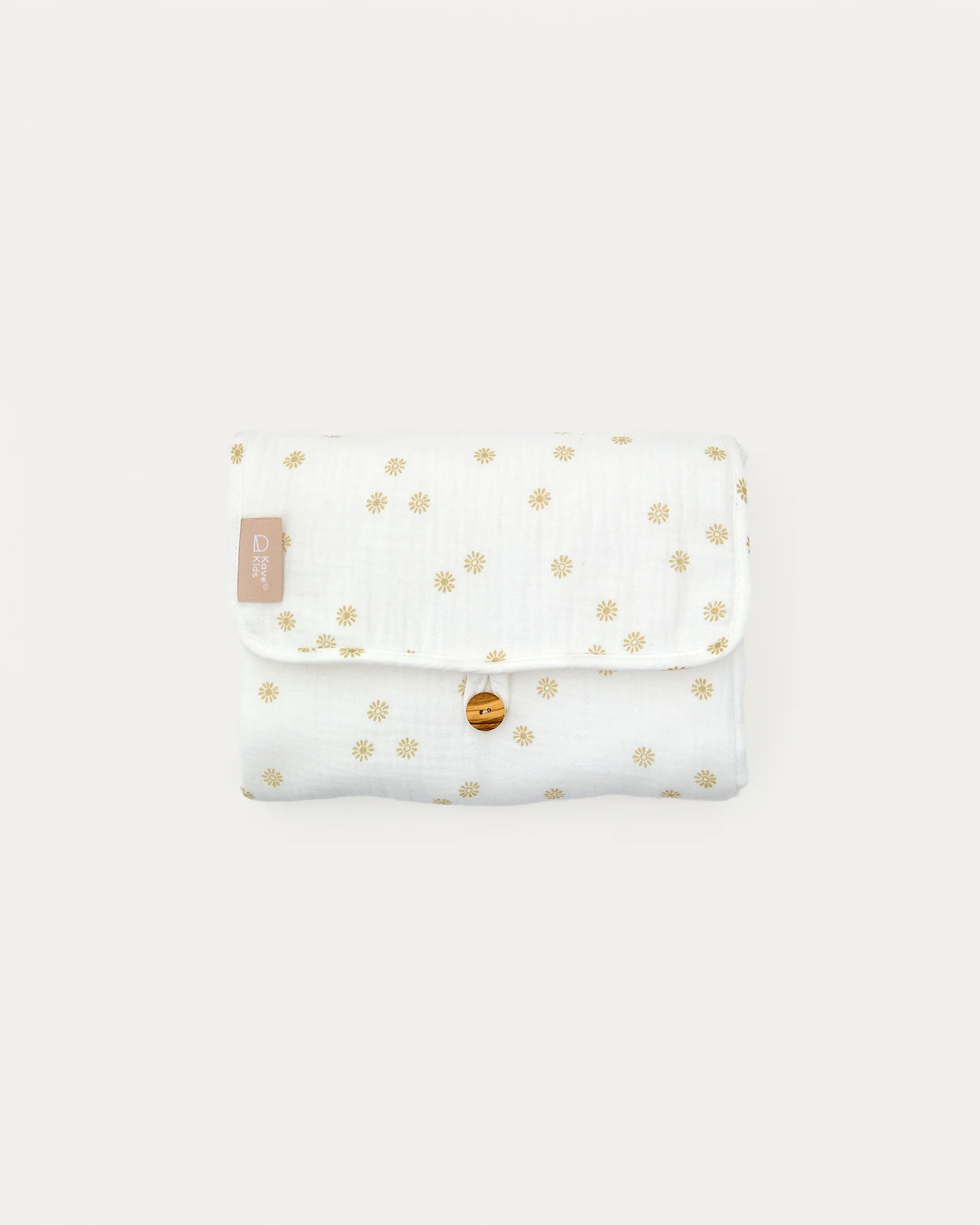 Olna travel changing mat in 100% cotton with a sun print