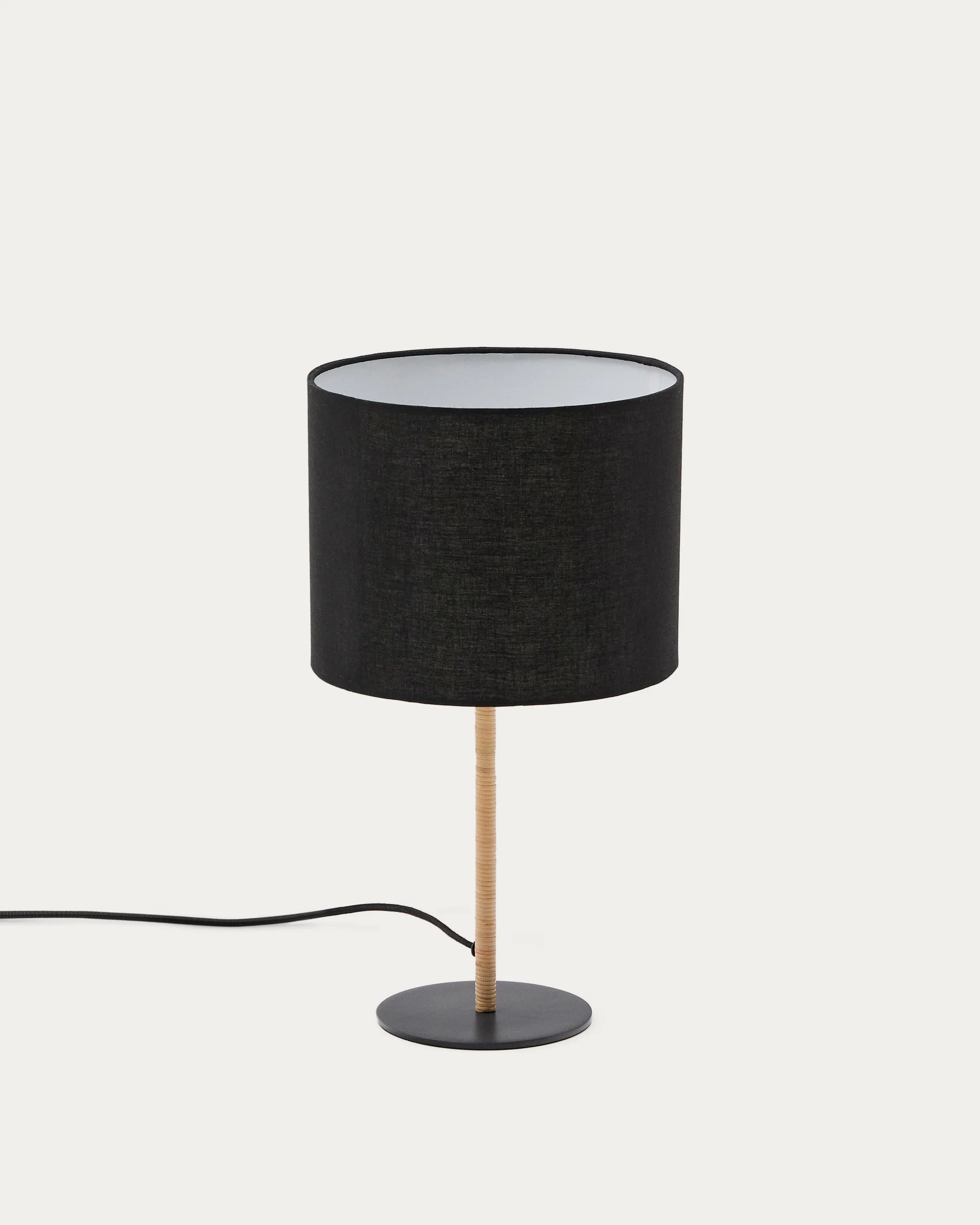 Pina metal and rattan table lamp with a black cotton lamp shade