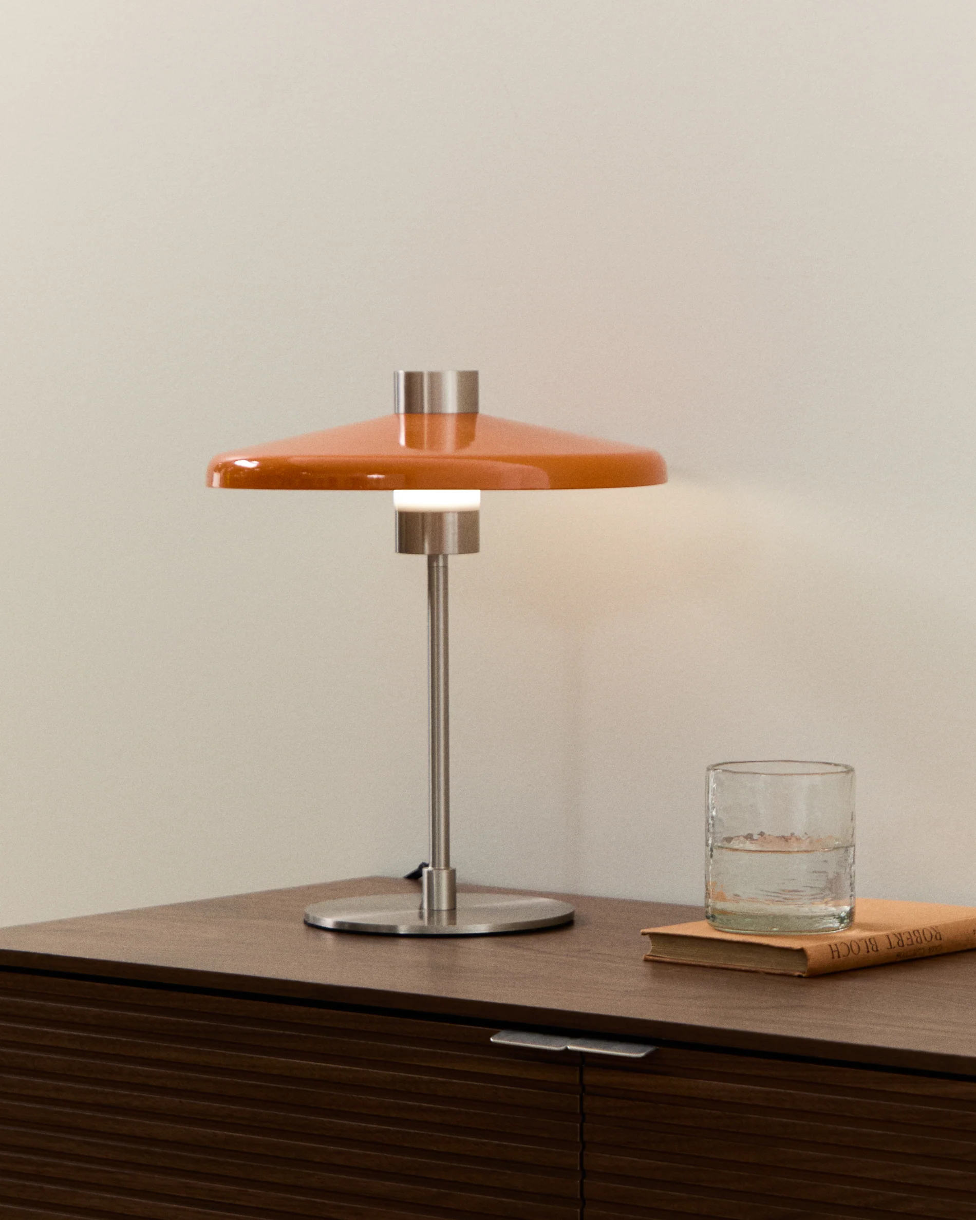 Nuvira table lamp in light grey brushed metal and orange lampshade