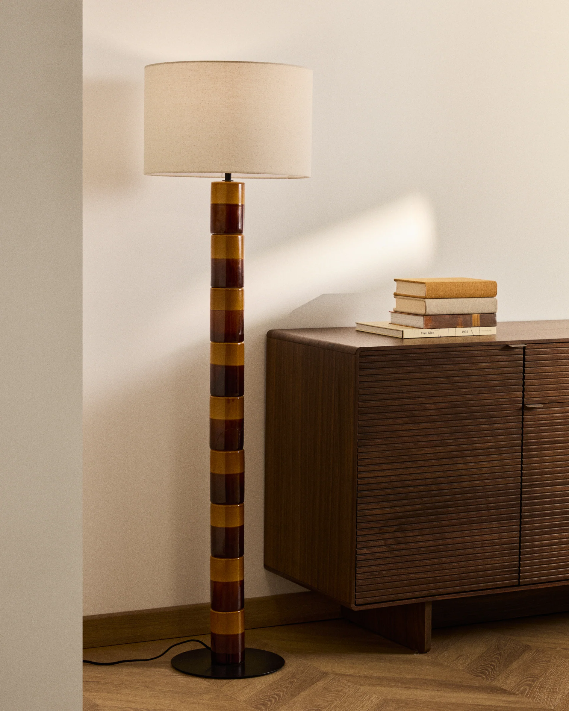 Mavran floor lamp with brown and mustard ceramic base and cotton lampshade