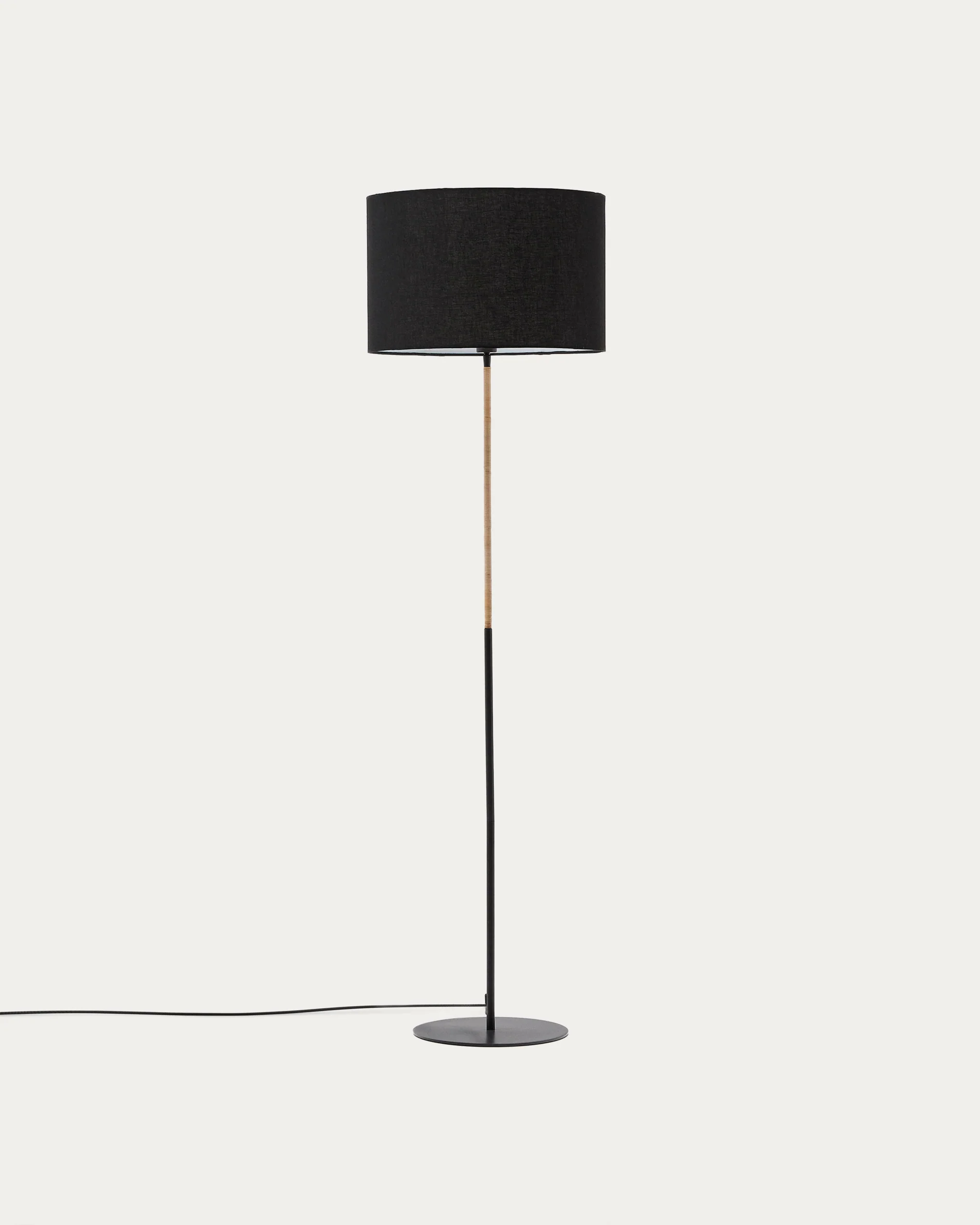 Canar metal and rattan floor lamp made with a black cotton lamp shade