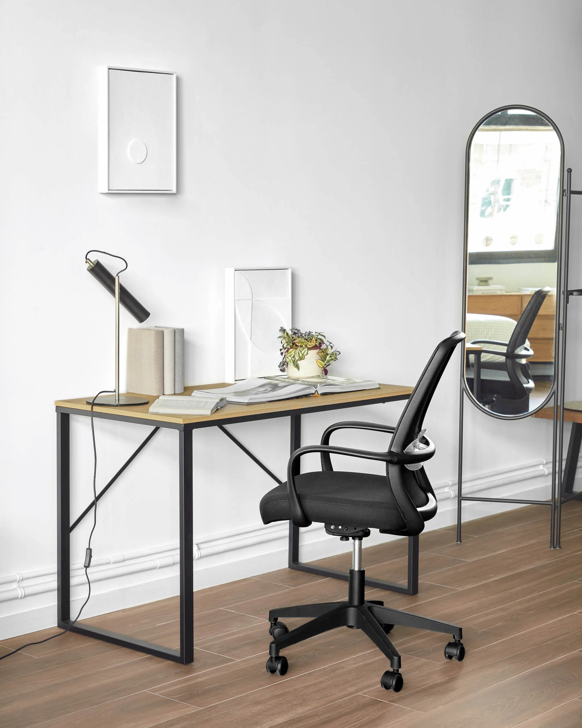 Melva office chair in black and legs made of steel in black