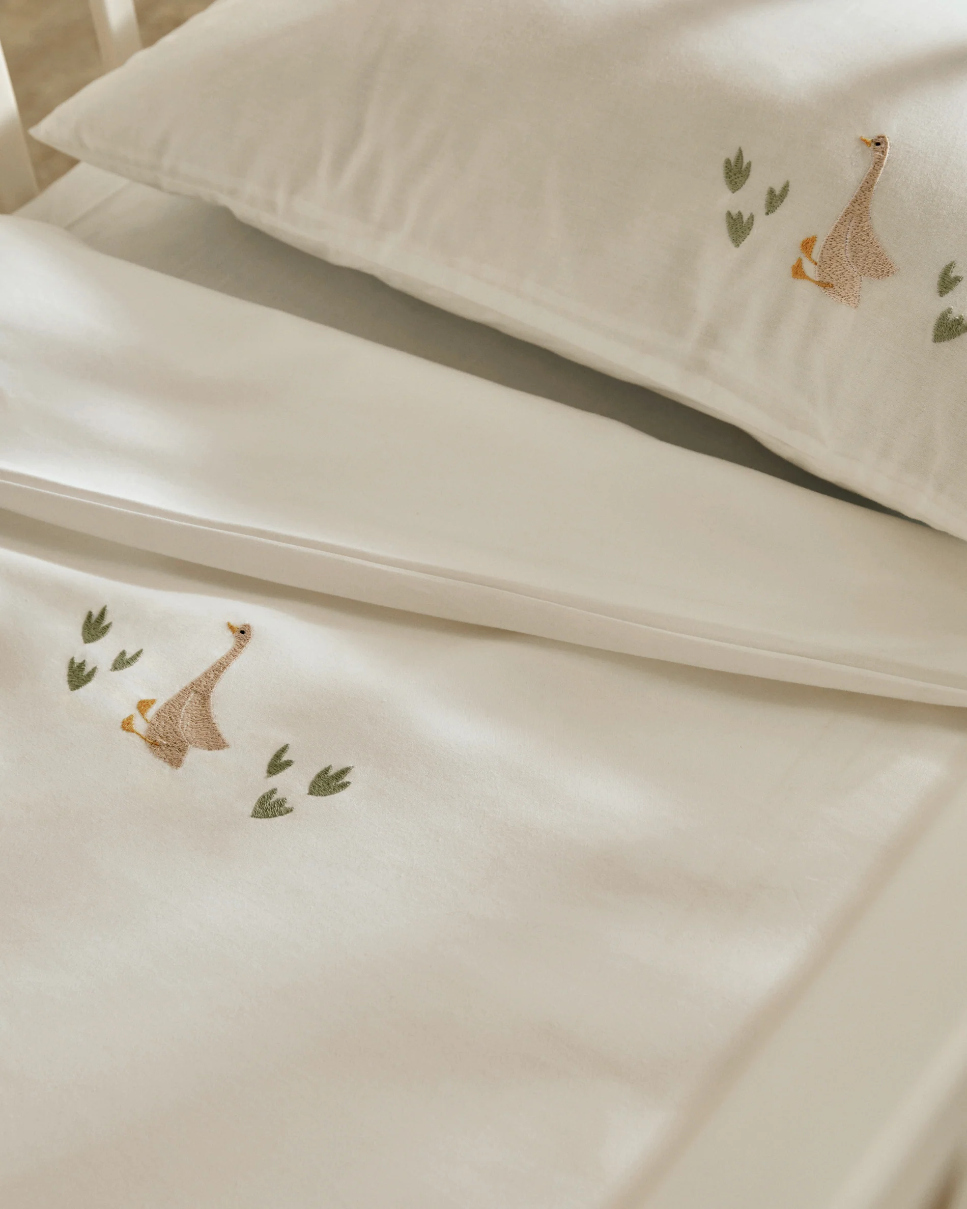 Milu set of duvet cover and pillow cases with embroidered goose for convertible cot and bed 70 x 140 cm