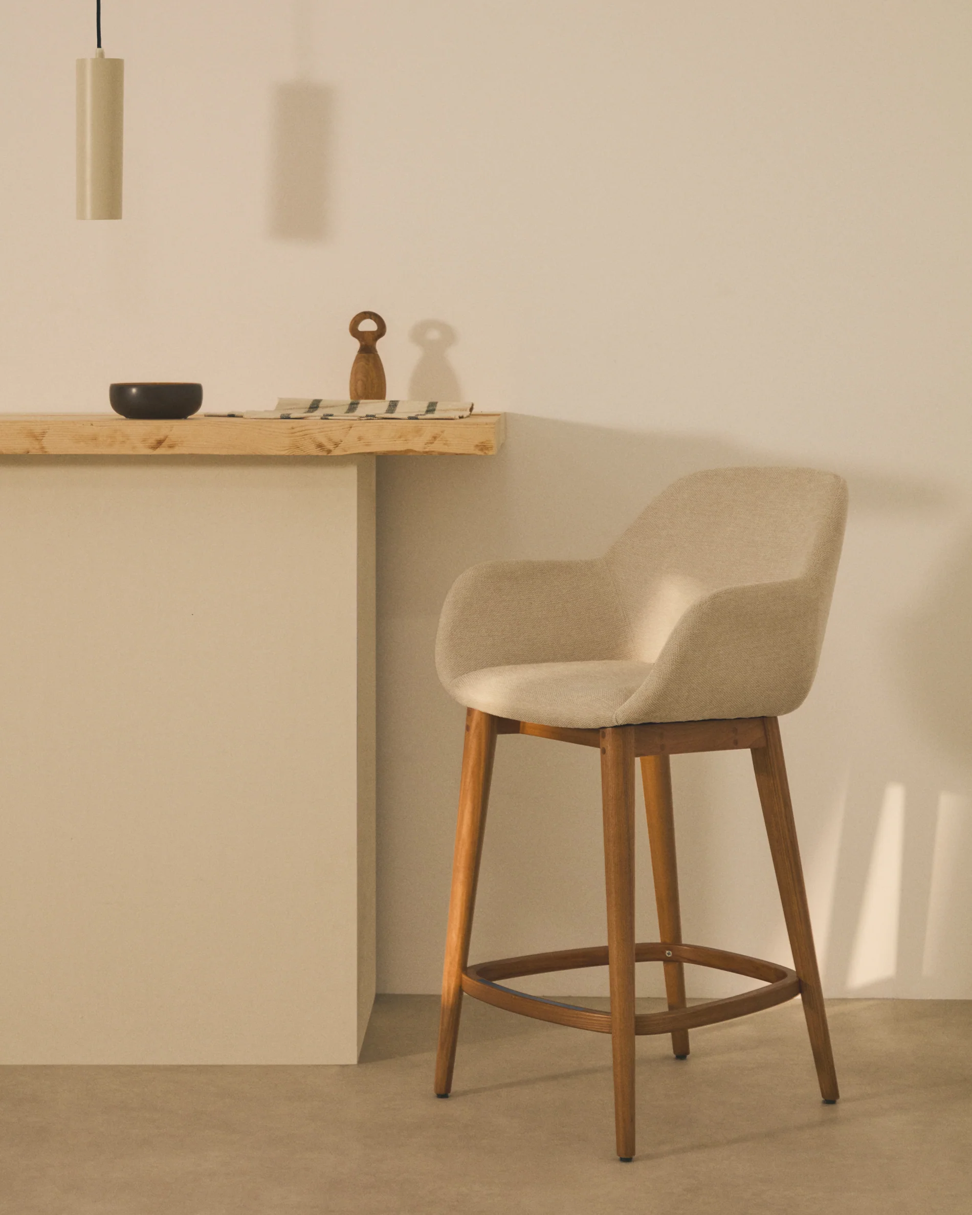 Konna stool in beige and solid ash wood legs in a dark finish, 65 cm