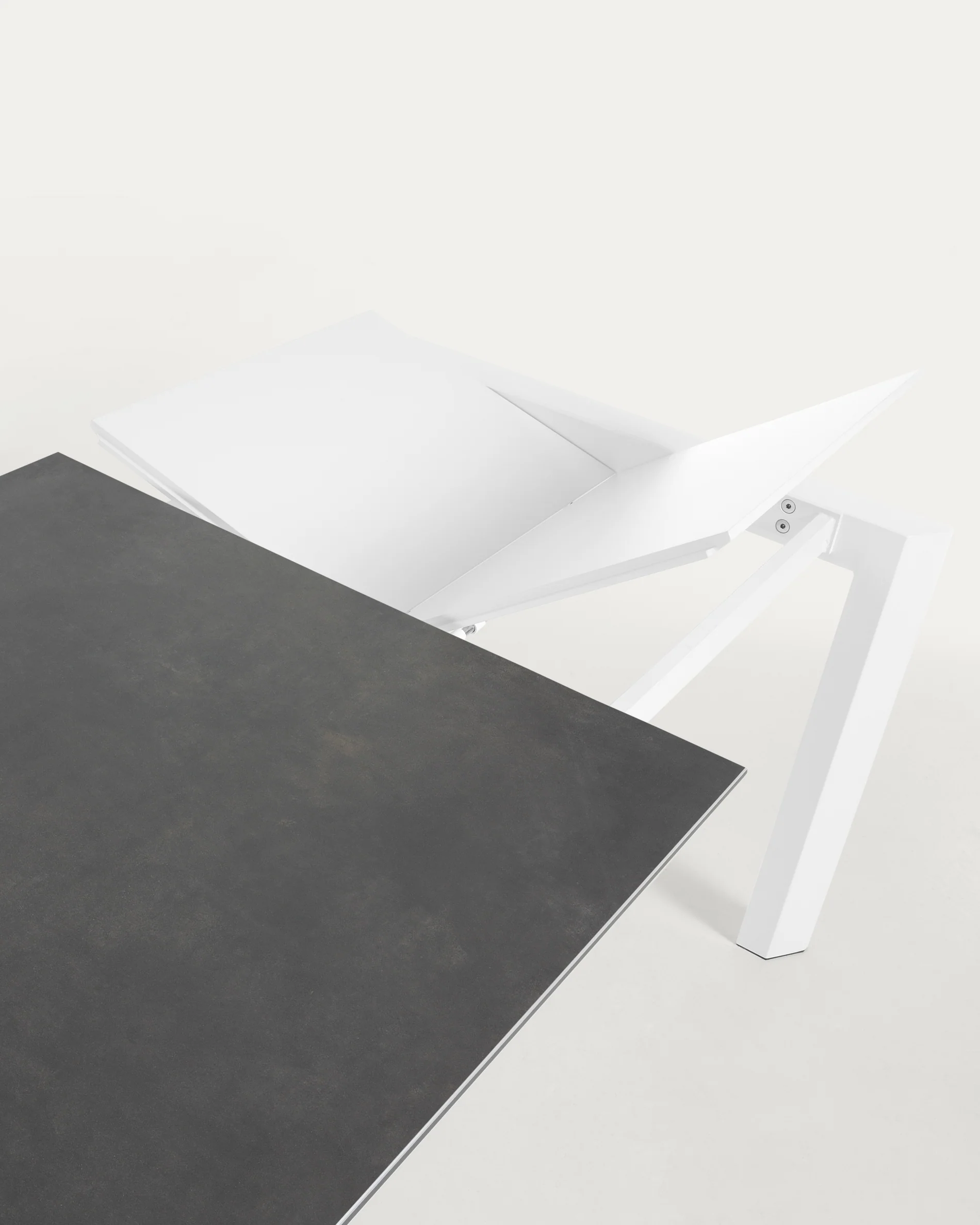 Axis porcelain extendable table in Volcano Rock finish with white steel legs 140 (200) cm