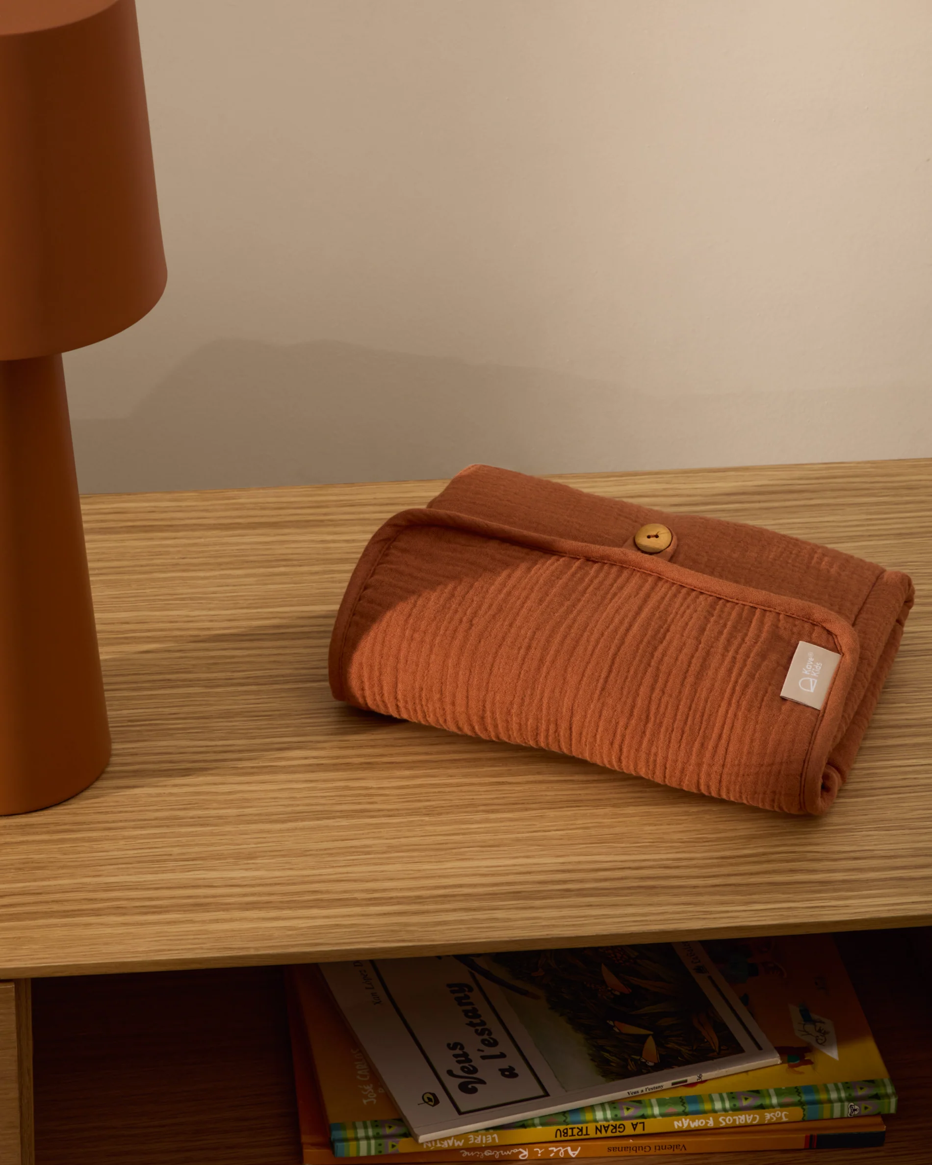 Olna travel changing mat in 100% terracotta cotton