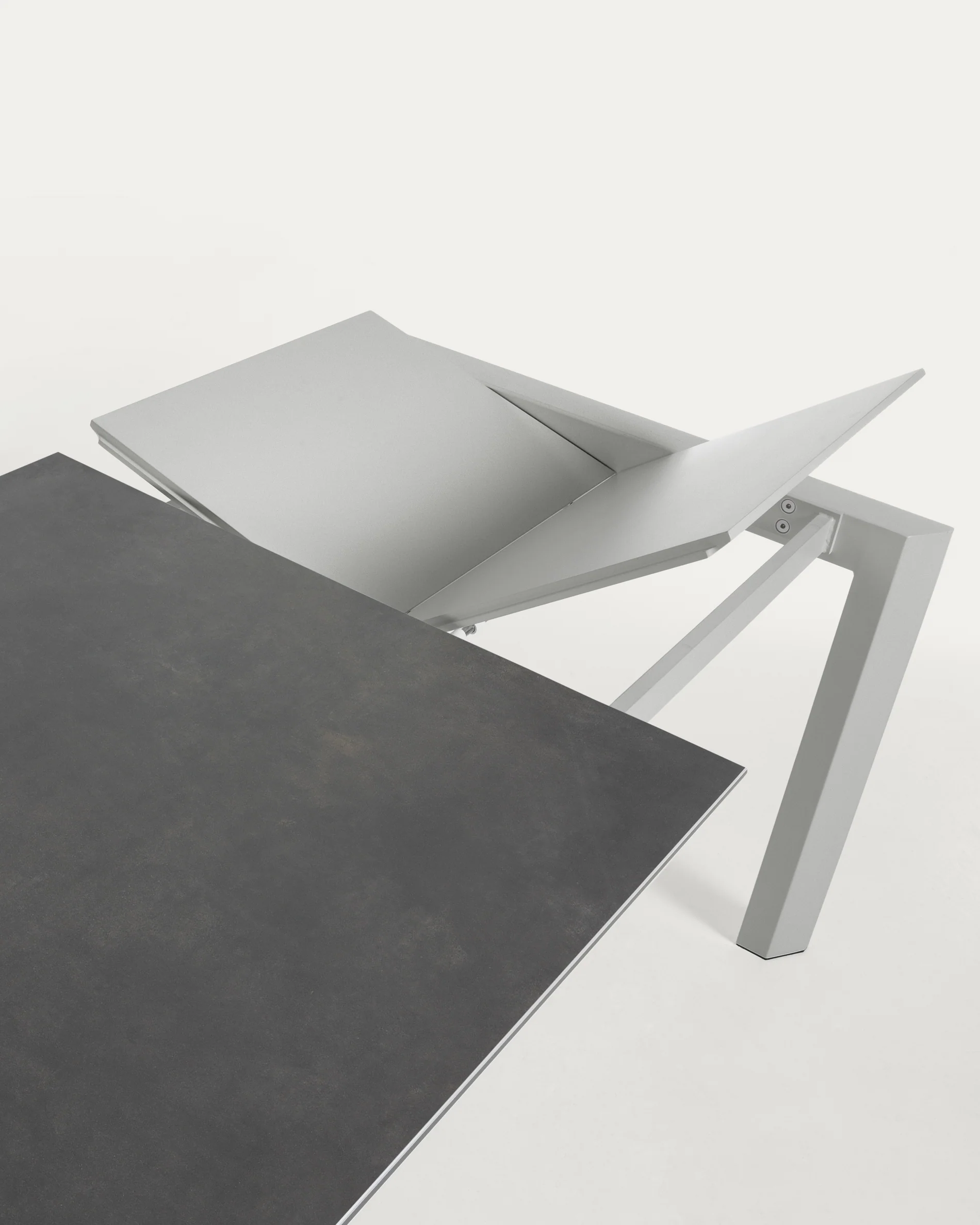 Axis porcelain extendable table in Volcano Rock finish with grey steel legs 120 (180) cm
